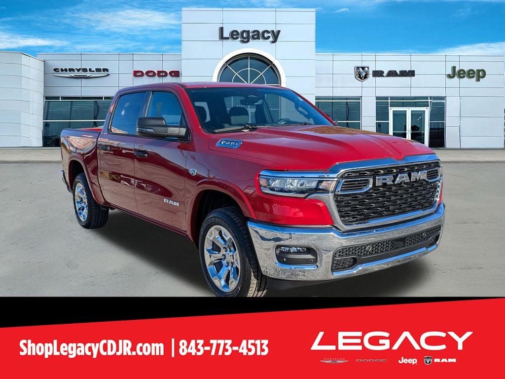 2026 RAM Ram 1500 RAM 1500 BIG HORN CREW CAB 4X4 5'7' BOX in Molten Red Pearl-Coat Exterior Paint — front three-quarter view