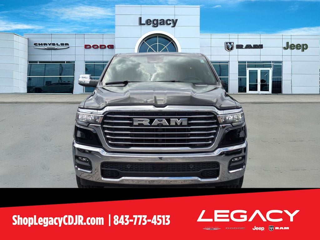 2026 RAM Ram 1500 RAM 1500 LARAMIE CREW CAB 4X4 5'7' BOX in Diamond Black Crystal Pearl-Coat Exterior Paint — front three-quarter view