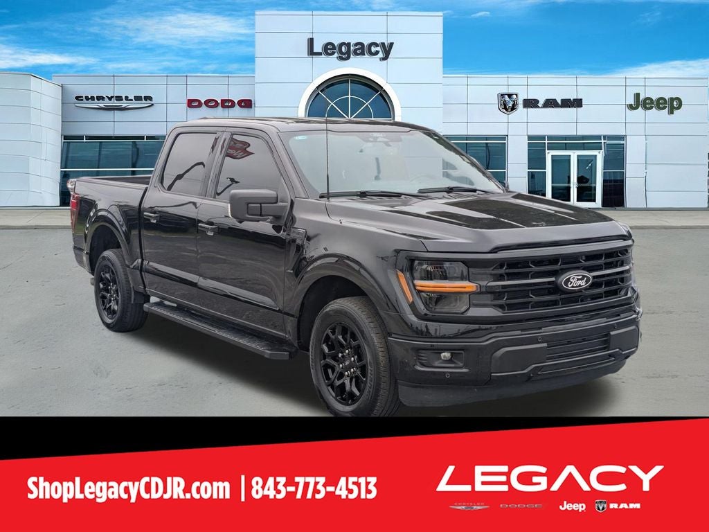 2024 Ford F-150 XLT in Black Metallic — front three-quarter view